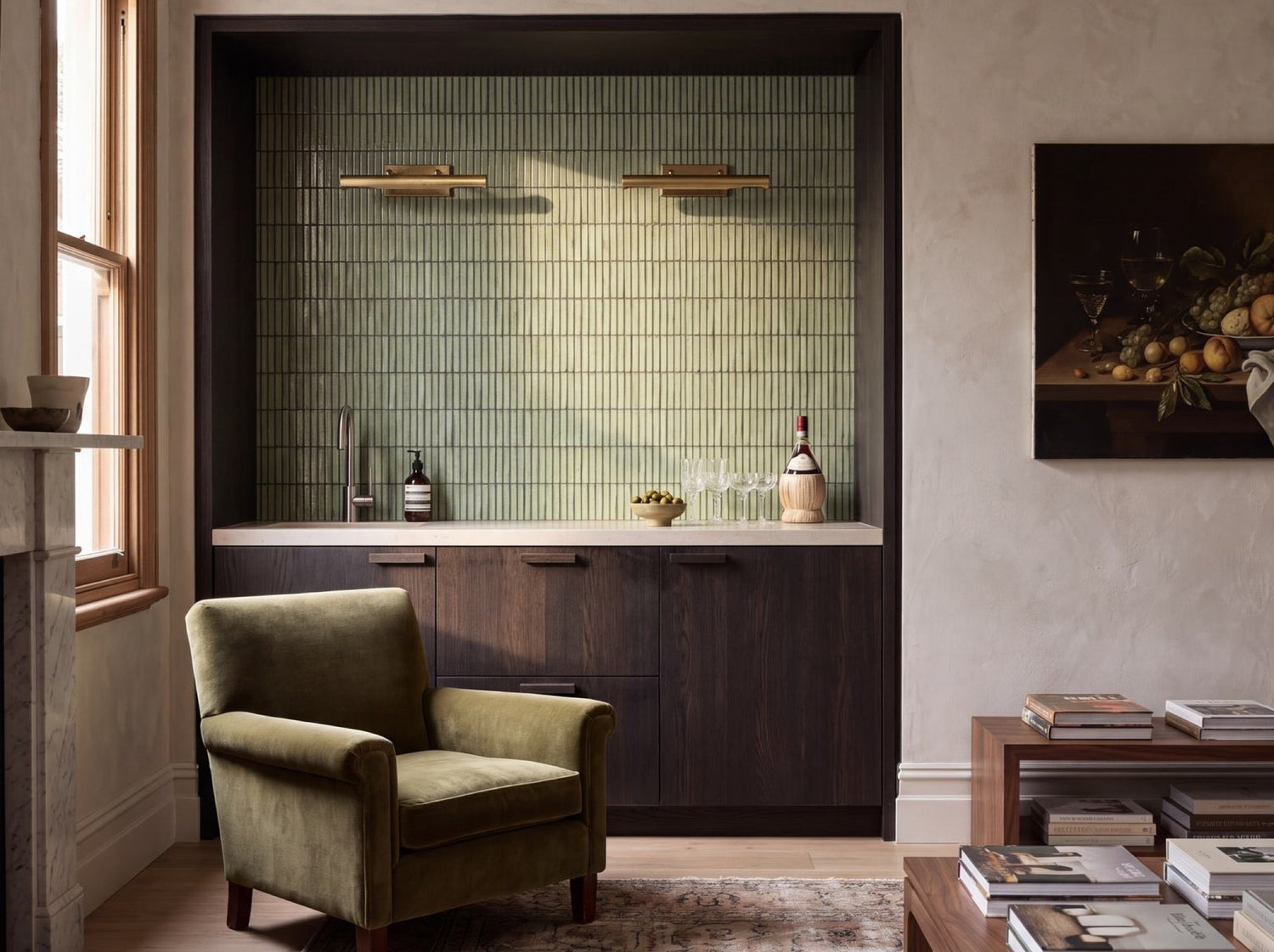 Shiki Sticks Green Stone finger mosaic behind a bar beside a fireplace and armchair