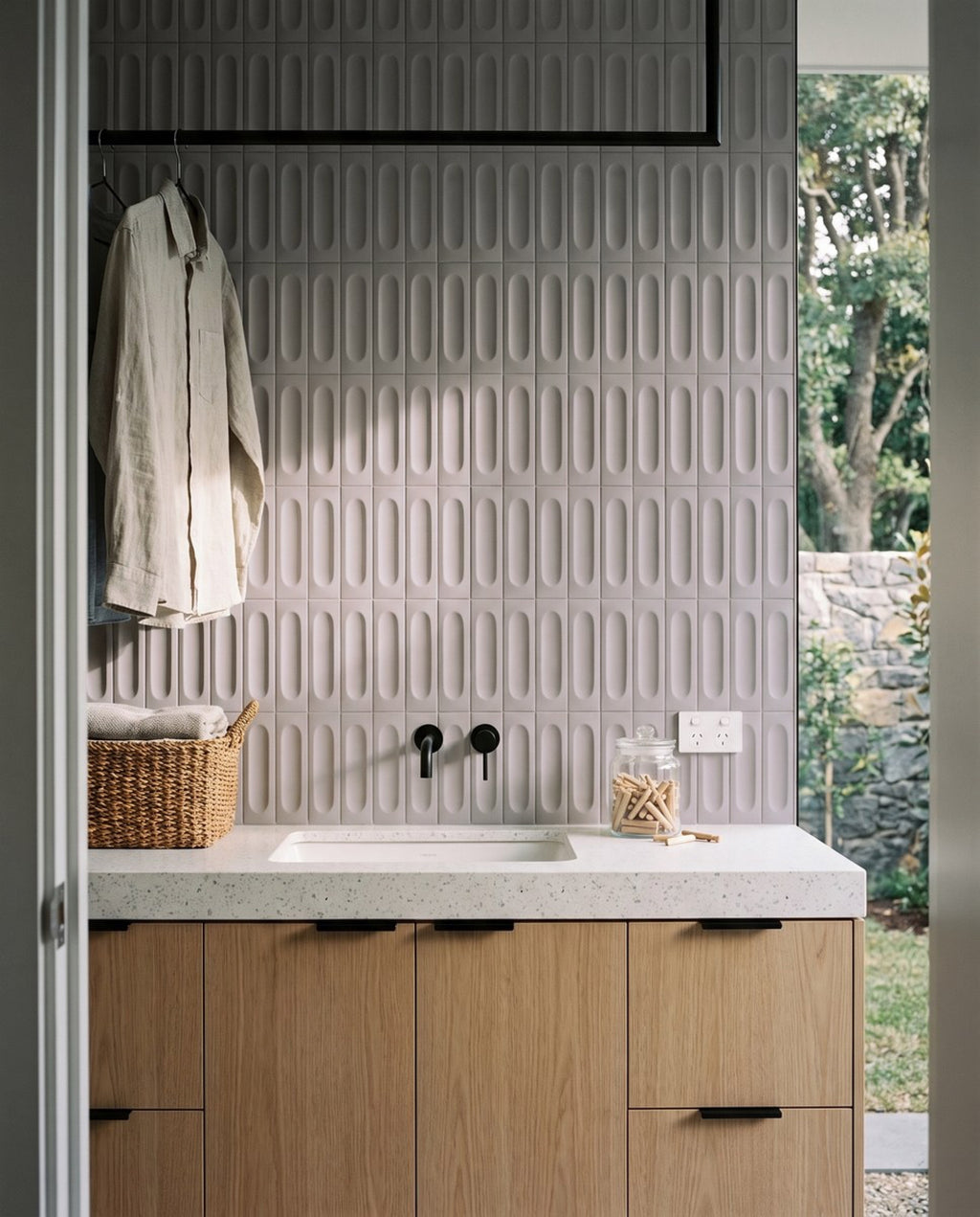 Confetto Grigio 3D Matt 50x150 tiles in a laundry