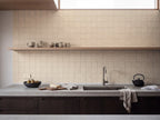 Blocchi Saltpan Matt 100x100 tiles in a room