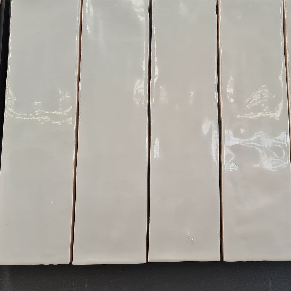 Hand Made New Dune Ash Gloss 75x300, tiles laid together