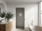 Loddon Salt White Gloss 100x300 tiles in a room