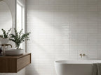 Luna Ghost Gum Gloss 60x240 tiles in a room