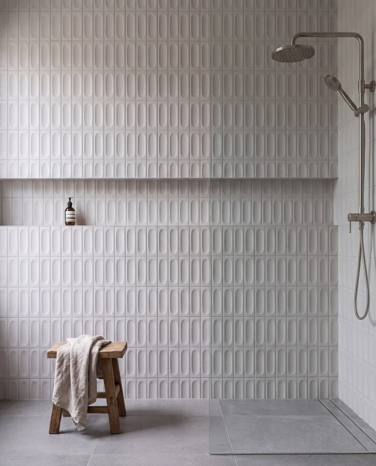 Tarwin Pebble 3D Matt 50x150 tiles in a shower